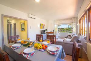 a dining room with a table with fruit on it at Villa Cohete - Plusholidays in Ifach
