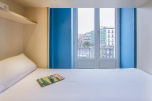 Postel nebo postele na pokoji v ubytování Mola Hostel
