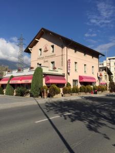 a large building on the side of a street at La Promenade in Sierre