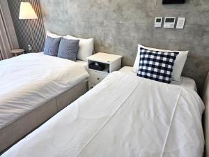 Postel nebo postele na pokoji v ubytování 라비앙즈-Raviens-Elliy's Room