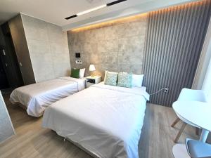 Postel nebo postele na pokoji v ubytování 라비앙즈-Raviens-Elliy's Room