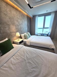Postel nebo postele na pokoji v ubytování 라비앙즈-Raviens-Elliy's Room