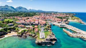 an aerial view of a town on the water at Apartamento La Ventana del Cuera in Llanes