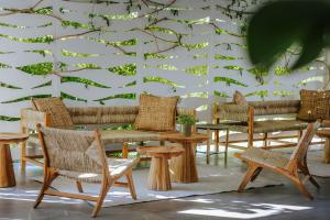 a wall with chairs and tables in a room at Nissi Park Hotel in Ayia Napa