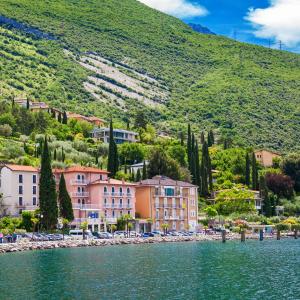 a town on the shore of a body of water at Lake Hotel Ifigenia in Nago-Torbole
