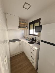 Η κουζίνα ή μικρή κουζίνα στο Estudio con vistas al puerto +1 φωτογραφίες
