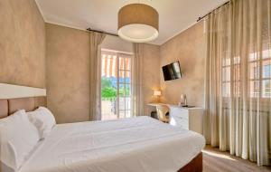 Łóżko lub łóżka w pokoju w obiekcie Hotel Conca D'Oro ***S