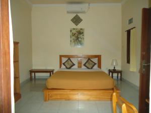 Ein Bett oder Betten in einem Zimmer der Unterkunft Kenari House