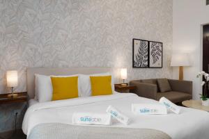 Vuode tai vuoteita majoituspaikassa Your gateway in Sparkle Tower JBR by Suiteable