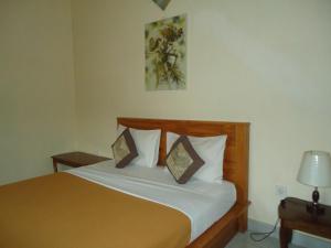 Ein Bett oder Betten in einem Zimmer der Unterkunft Kenari House