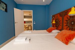 Ein Bett oder Betten in einem Zimmer der Unterkunft Africa Master Suite