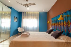 Ein Bett oder Betten in einem Zimmer der Unterkunft Africa Master Suite
