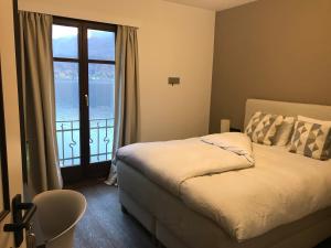 Postel nebo postele na pokoji v ubytování Arbostora Charme Hotel