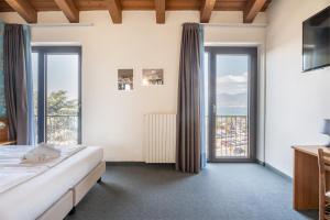 Postel nebo postele na pokoji v ubytování Hotel Al Castello