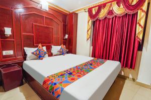 Postel nebo postele na pokoji v ubytování FabHotel Roshan Residency - Nr Kurinji Andavar Temple + 15 fotografií