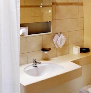 a bathroom with a sink and a mirror at Hotel zum Roten Löwen in Hildisrieden