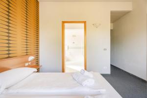 Postel nebo postele na pokoji v ubytování Hotel Al Castello
