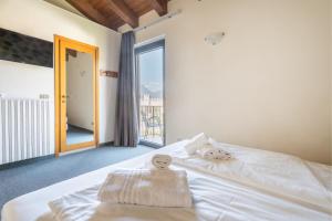 Postel nebo postele na pokoji v ubytování Hotel Al Castello