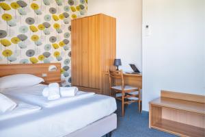 Postel nebo postele na pokoji v ubytování Hotel Al Castello