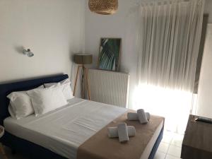 Ein Bett oder Betten in einem Zimmer der Unterkunft Xastero