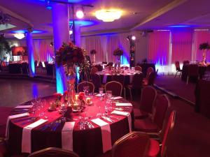 a room with tables and chairs with wine glasses at Via Baltica in Sargėnai
