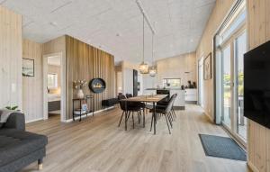 a dining room and living room with a table and chairs at Pet Friendly Home In Hemmet With Wifi in Hemmet