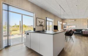 a kitchen with a counter and a living room at Pet Friendly Home In Hemmet With Wifi in Hemmet +18 photos