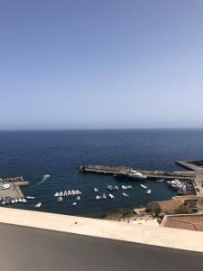 a view of a harbor with boats in the water at Hotel Ariston in Ustica