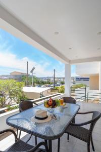 Balkón nebo terasa v ubytování Plumeria Apartment Sitia