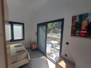 a room with a bed and a view of a balcony at Turunc MARIN Villa1 in Marmaris +24 photos