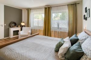 a bedroom with a large bed and a window at Ferienwohnung Fahrradland und Meer in Moormerland