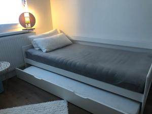 a bed sitting in a room with a window at Ferienwohnung Soltau in Soltau