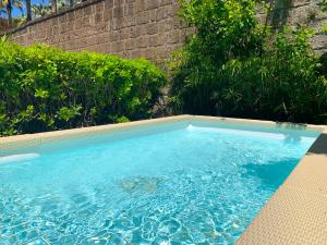 Bazén v ubytování Villa Flavia nebo v jeho okolí