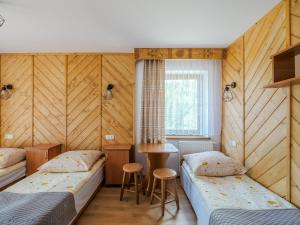 Tempat tidur dalam kamar di Ośrodek Wczasowy Pasternik
