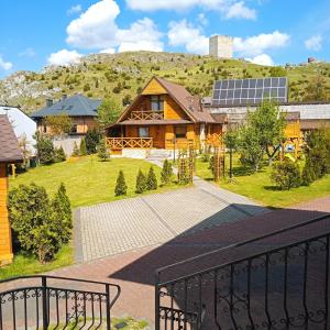 an aerial view of a house with a mountain at NOCLEGI KAMEX dom 12-osobowy in Olsztyn