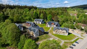 an aerial view of a large house in a forest at Apartamenty Good Time - Osada Górska przy szlaku na Chybotek in Szklarska Poręba