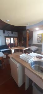 a kitchen with a sink and a keyboard on a counter at Chalupa Magdaléna in Terchová +17 photos
