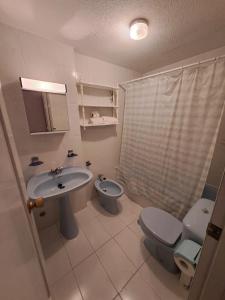 a bathroom with a sink and a toilet and a shower at Apartamentos Ágata V.v. in La Manga del Mar Menor
