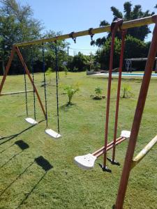 an empty swing set in a park at Casa chacra campo en victoria entre rios in Victoria +75 photos