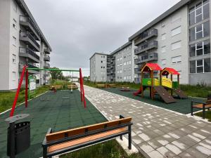 a park with a playground with a slide at Violet deluxe in Niš