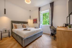 Postel nebo postele na pokoji v ubytování Jupiter Luxury Accommodation