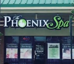 a store with a sign on the front of a store at Super Inn & Suites Carrollton in Carrollton