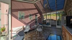 a screened in porch with a table and chairs at Villa Sarita in Sestri Levante