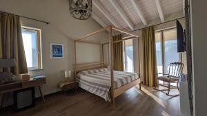 Postel nebo postele na pokoji v ubytování Villa Sarita