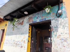 an entrance to a building with a face painted on it at Hotel Casa Nikté in Antigua Guatemala