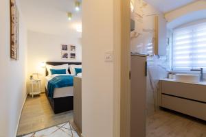 Postel nebo postele na pokoji v ubytování Luxury Lifestyle Rooms