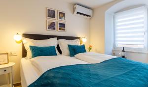 Postel nebo postele na pokoji v ubytování Luxury Lifestyle Rooms