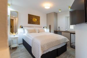 Postel nebo postele na pokoji v ubytování Luxury Lifestyle Rooms