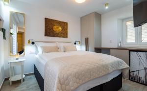 Postel nebo postele na pokoji v ubytování Luxury Lifestyle Rooms