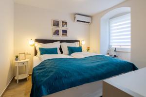 Postel nebo postele na pokoji v ubytování Luxury Lifestyle Rooms